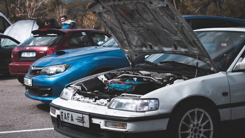 blue bmw m 3 parked on parking lot during daytime